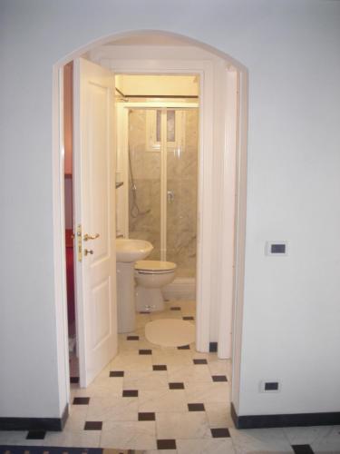a bathroom with a toilet and a sink at Infinity view in Vernazza