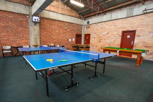 a room with three ping pong tables in it at Sovereign Park Motor Inn in Ballarat