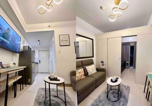 a living room and a kitchen with a couch and a table at 1 BR South Residences SM Southmall Netflix / Alexa in Manila