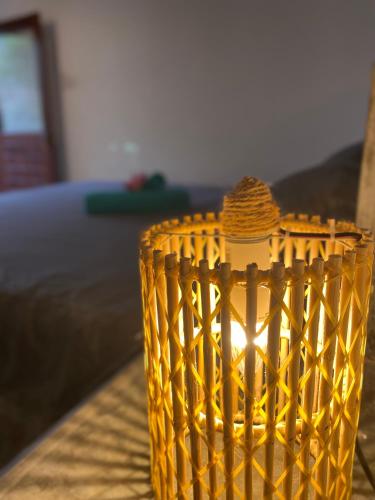 a yellow vase sitting on top of a table at The Calm Palm in Hikkaduwa