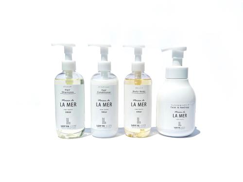 a group of four bottles of li water on a shelf at Lotte City Hotel Kinshicho in Tokyo