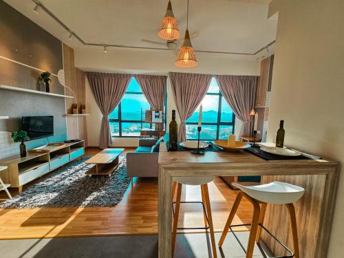 a living room with a table and a couch at 1 min to Seaview & Sunrise Heart of Kuantan in Kuantan