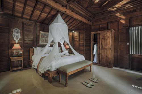 Ένα ή περισσότερα κρεβάτια σε δωμάτιο στο Portobello Villa Ubud