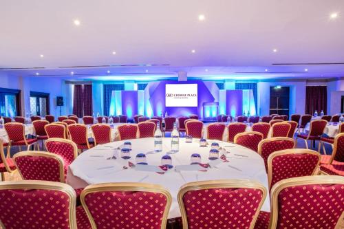 a conference room with a long table and chairs at Crowne Plaza Liverpool - John Lennon Airport by IHG in Liverpool