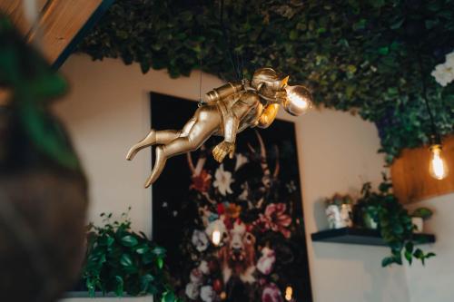 a statue of a man hanging from a ceiling at Johnys Jungle in Marbach an der Donau