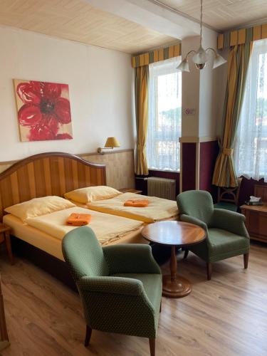Postel nebo postele na pokoji v ubytování Hotel U Branky