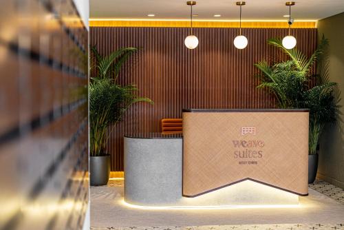 a lobby with a sign that reads wave studios at Weave Suites - Midtown in Singapore