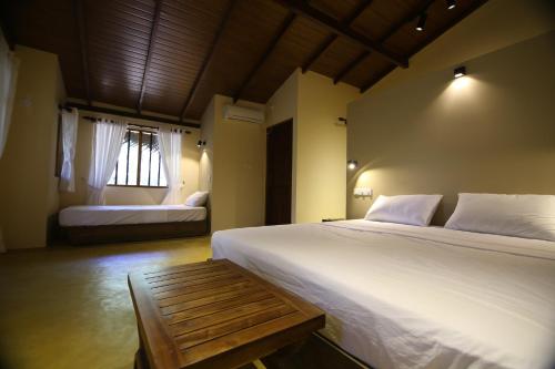 Postel nebo postele na pokoji v ubytování Cloud Nine Lanka Resort Wilpattu