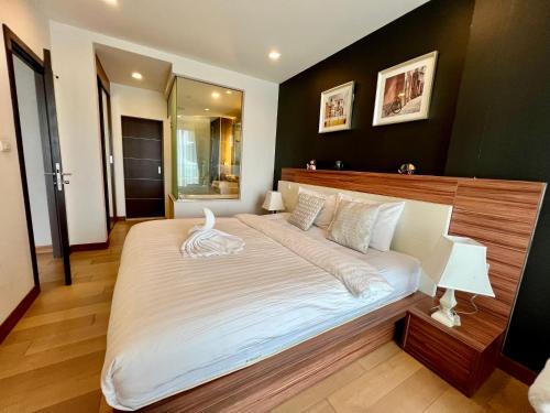 Postel nebo postele na pokoji v ubytování Cozy Luxury Condo @ The Astra