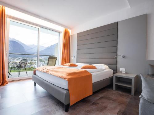 Postel nebo postele na pokoji v ubytování Hotel Benacus Panoramic