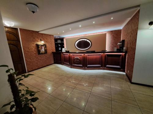 a lobby with a large room with a large mirror at Hotel Górski in Wolbórz
