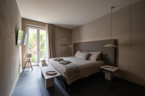 a bedroom with a large bed and a window at The Sanctuary Urban Retreat in Rome