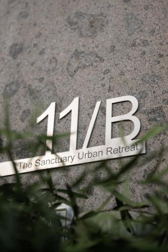 a sign on the side of a building at The Sanctuary Urban Retreat in Rome