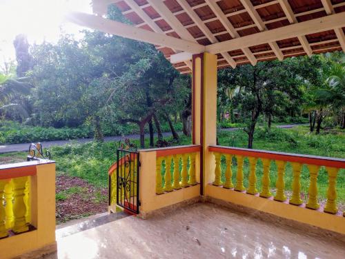 a view from the porch of a house at The Grace Guest House in Salcete