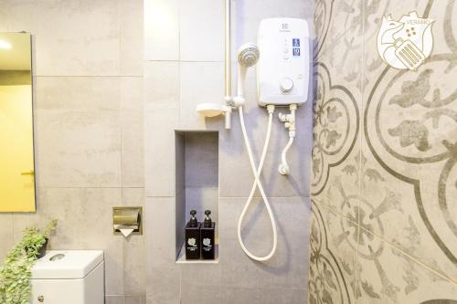 a shower in a bathroom with a toilet at Zen-Inspired Duplex Luxury 6Pax, Arte Mont Kiara by Verano in Kuala Lumpur