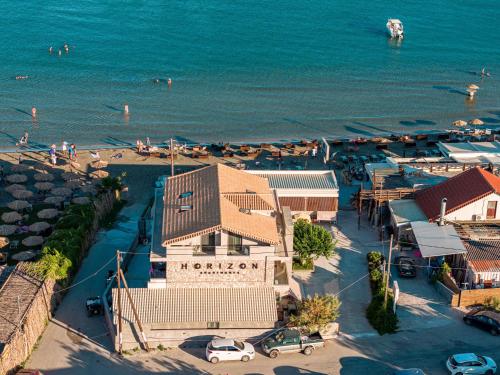 an aerial view of a beach with a marina at Horizon Apartments - Beachfront Luxury, by ZanteWize in Laganas
