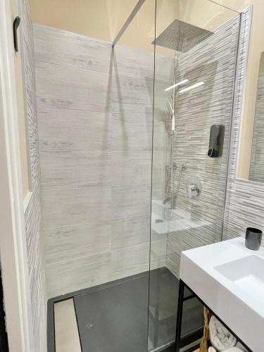 a bathroom with a shower and a sink at Regina Elena Rooms in Pescara