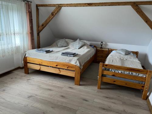 Ένα ή περισσότερα κρεβάτια σε δωμάτιο στο Zacisze