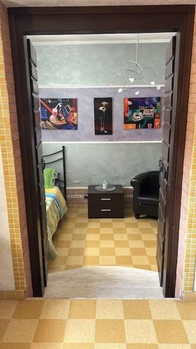 a room with a bedroom with a bed and a doorway at CASA EVA in Celano