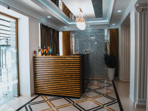 a lobby with a reception desk in a building at Art Plaza Hotel in Tashkent