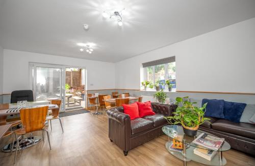 a living room with a couch and a table at Flexistay Aparthotel Sutton in Sutton