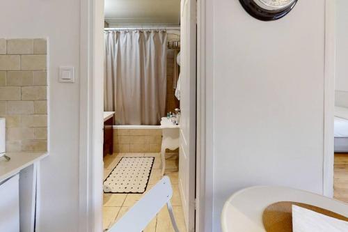 a bathroom with a shower and a toilet and a sink at Strategic 2BR Dizengoff Gordon in Tel Aviv
