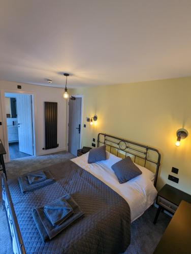 a bedroom with a bed with two pillows on it at The Wolfe Inn Wolfscastle in Haverfordwest