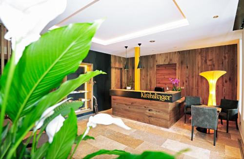 a lobby of a hotel with a reception desk at Hotel Restaurant Kirchsteiger in Vollan