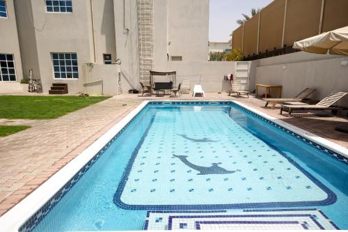 Relaxing Private Rooms in Compound Housing near Burj Alarab Villa 124