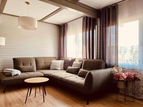 a living room with a couch and a table at leaf in Kirchheim