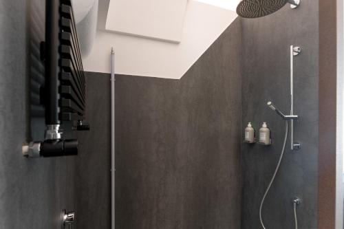 a bathroom with a shower with a shower head at Arya Nobile Dimora in Carovigno