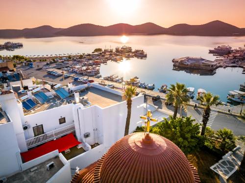 an aerial view of a marina at sunset at Kalypso Suites Hotel - Adults Only in Elounda
