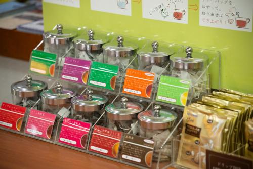 a display of food in plastic containers on a shelf at Kagoshima Plaza Hotel Tenmonkan in Kagoshima