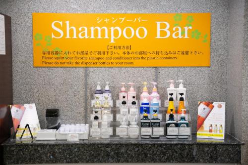 a counter with bottles of alcohol on it at Kagoshima Plaza Hotel Tenmonkan in Kagoshima