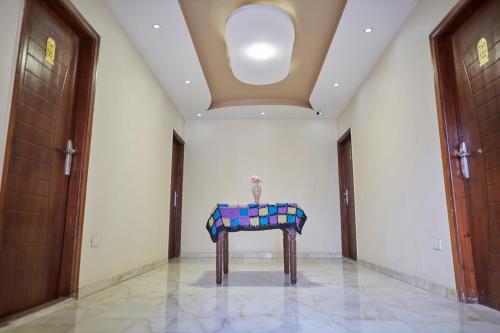 a table in a hallway with a ceiling at Grand Pyramid View Hotel in Cairo