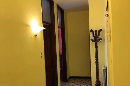 a hallway with a light next to a door at Appartamento Jimmy in Pontremoli