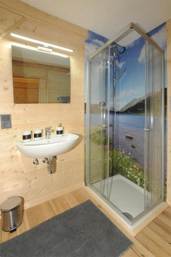 a bathroom with a sink and a shower at Ferienhof Holzmeister in Sankt Jakob in Haus