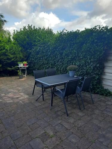 a black table and chairs on a patio at Quarenta Studio in Amsterdam