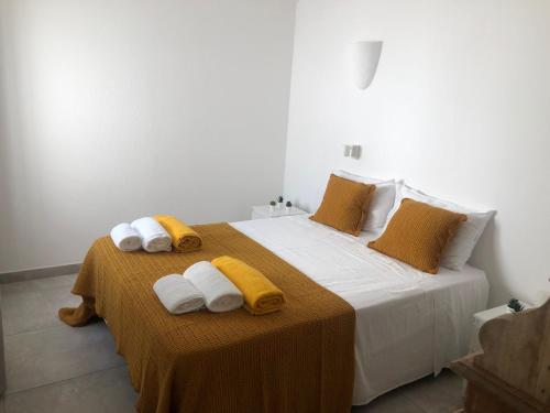מיטה או מיטות בחדר ב-Casa do Poço