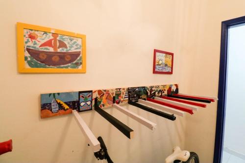 a wall with a bunch of knives hanging on a wall at Beach House Lanzarote in Arrecife