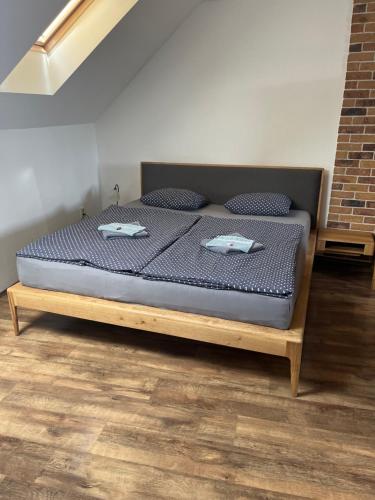 a bed with two pillows on it in a room at Penzión Pri Mlyne in Nitra