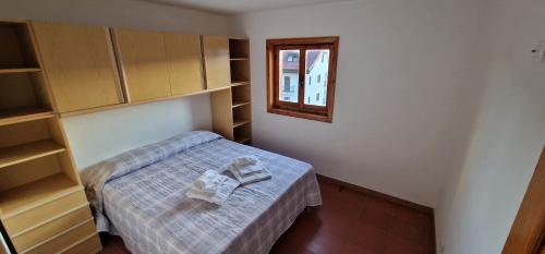 Ένα ή περισσότερα κρεβάτια σε δωμάτιο στο La Baita di Marianna