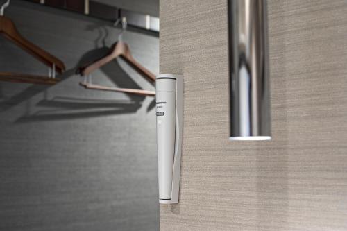 a remote control on the door of a closet at Hotel Ninja Black in Kyoto