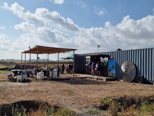 a group of people standing at a bus stop at Mandria Villa in Paphos in Mandria