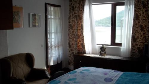 Ένα ή περισσότερα κρεβάτια σε δωμάτιο στο Karuc Apartments