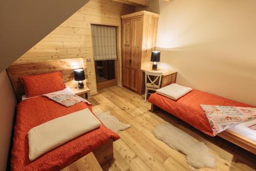 Postel nebo postele na pokoji v ubytování Apartments Krvavec