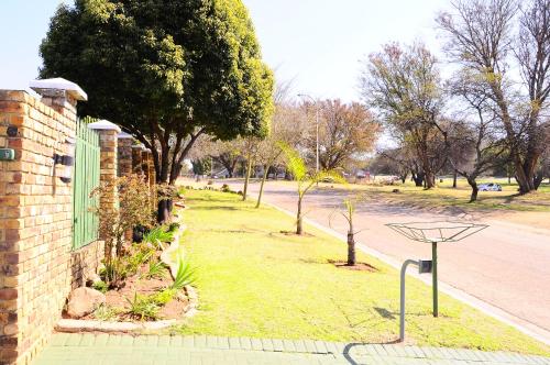 a basketball hoop on the side of a street at Courtlyguesthouse in Witbank
