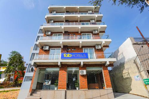 a building with a io hotels sign on it at FabHotel Unique Stay in Noida