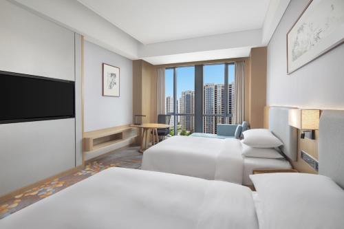 Ein Bett oder Betten in einem Zimmer der Unterkunft Courtyard by Marriott Hangzhou Xiaoshan
