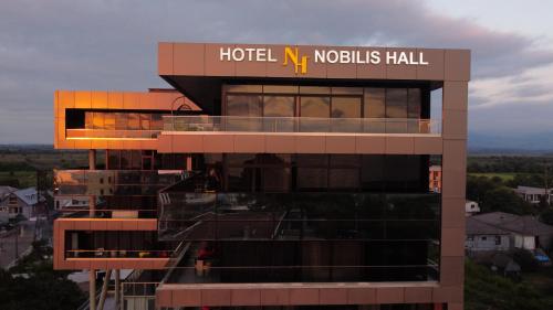 a hotel niossili hall with a sign on top of it at Hotel Nobilis Hall in Kobuleti